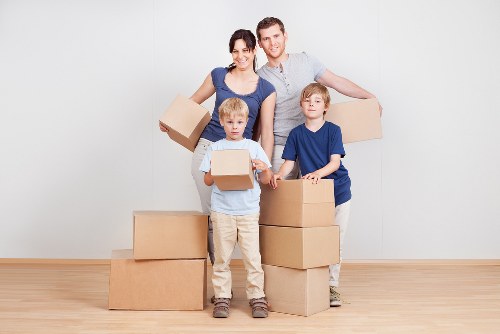 Healthy team members maintaining safe standards during a move