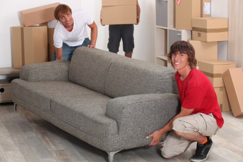 Packed household boxes and furniture ready for removals in a Marylebone flat