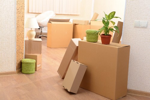 Professional commercial movers handling furniture in a central London property